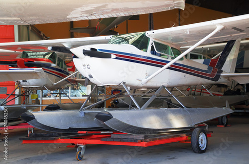 Close-up view of floatplanes (seaplanes) standing in hangar.