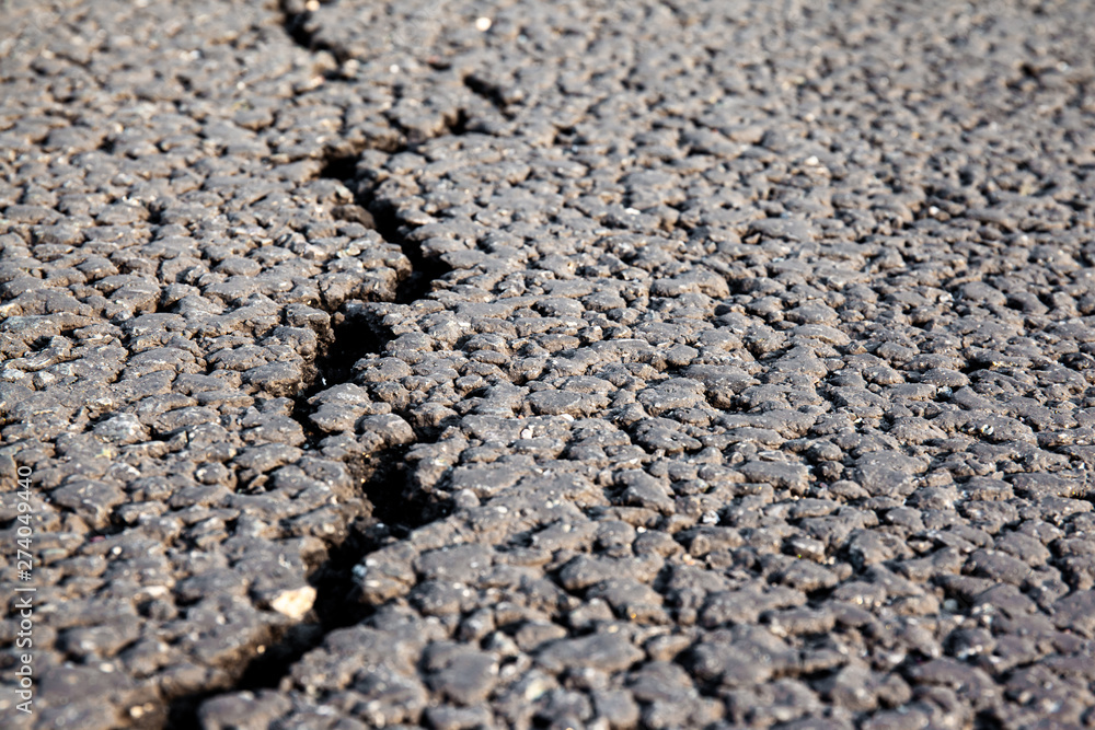 close up of a crack on a new asphalt close up of a crack on a new asphalt