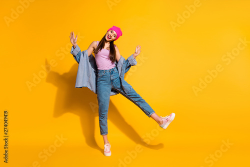 Full length body size view photo of nice pretty millennial hold hand have rest relax free time wear sneakers fashionable clothing isolated yellow background
