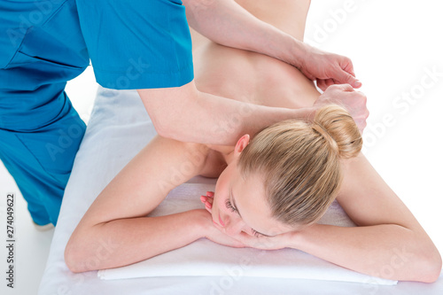 Therapist giving back massage to man against highlighted pain