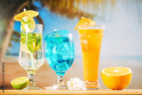 Mint blue orange drinks and sliced citrus white flowers