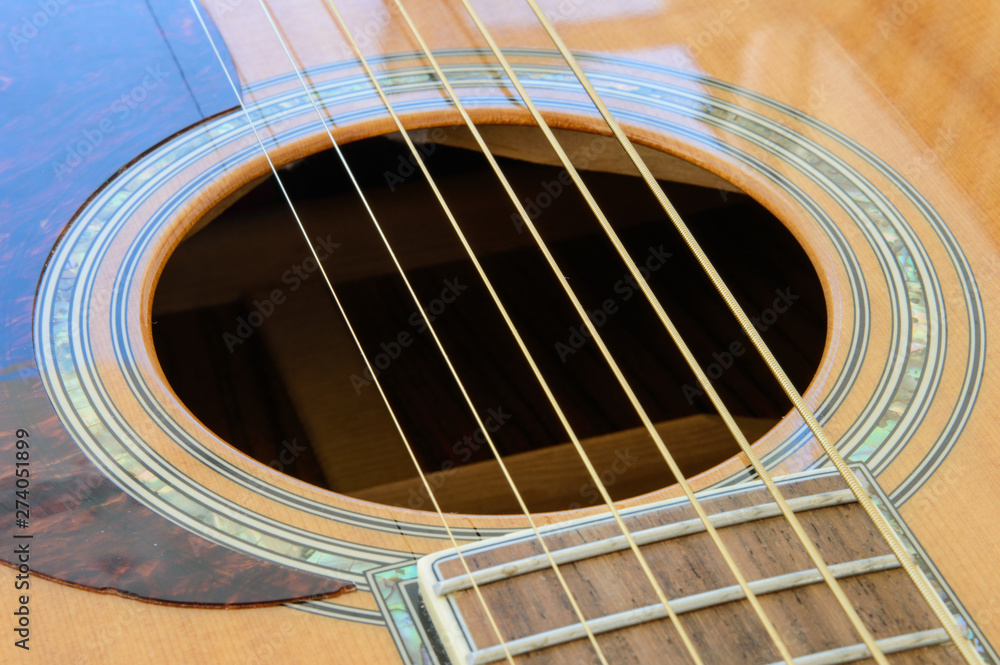 Obraz premium Acoustic Guitar detail - sound hole - above side