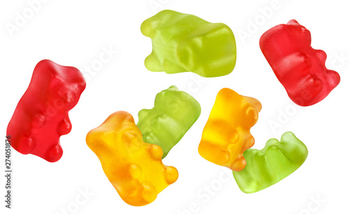 Flying colorful jelly gummy bears, isolated on white background photo