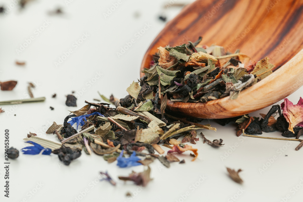 Dried tea heaped teaspoonful on white background, closeup Dried tea heaped teaspoonful on white background, closeup