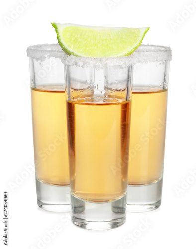 Shot of tequila with a slice of lime no white background