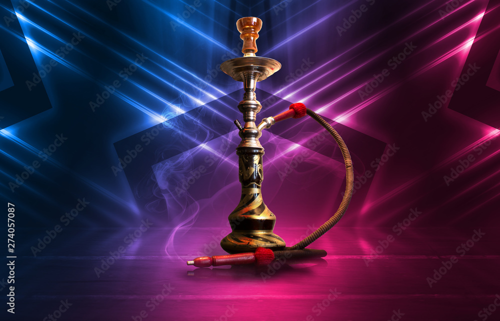 Hookah, smoke on a dark abstract background. Background of empty scenes with multicolored neon lights, reflection of night lights on wet pavement Hookah, smoke on a dark abstract background. Background of empty scenes with multicolored neon lights, reflection of night lights on wet pavement