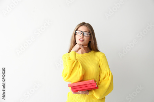 Thoughtful young woman with...
