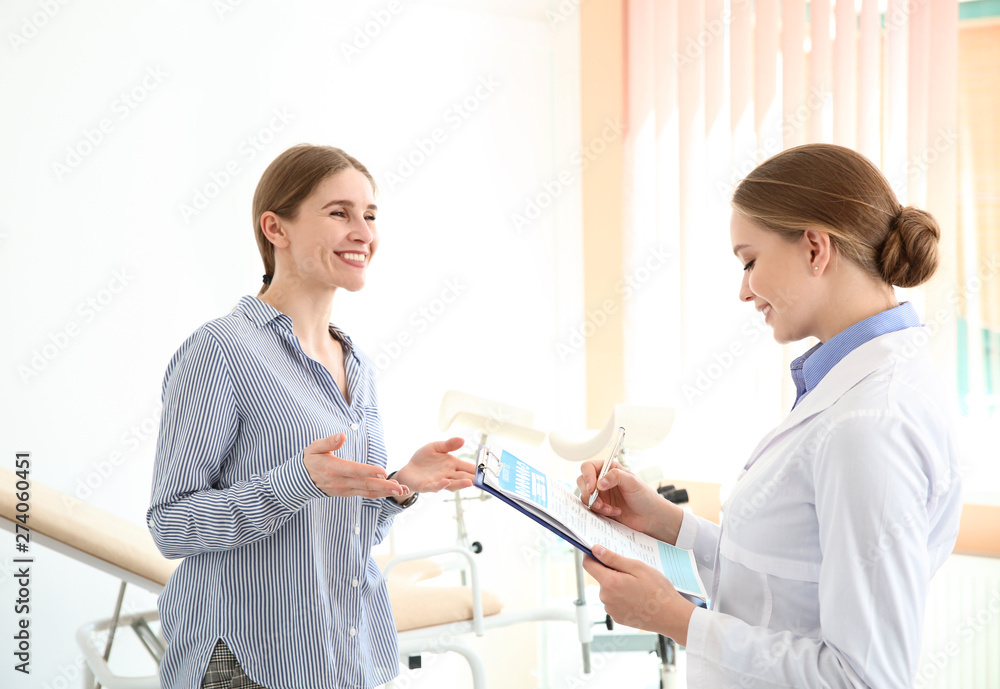 Young woman visiting her gynecologist in clinic Young woman visiting her gynecologist in clinic