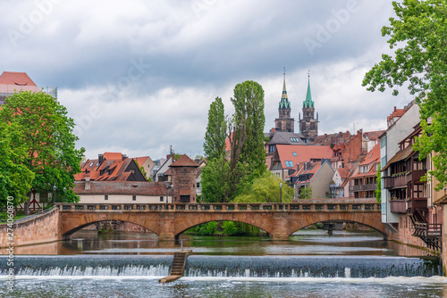 Old stone bridge over the river in Nuremberg