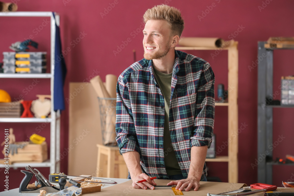 Male carpenter working in shop Male carpenter working in shop