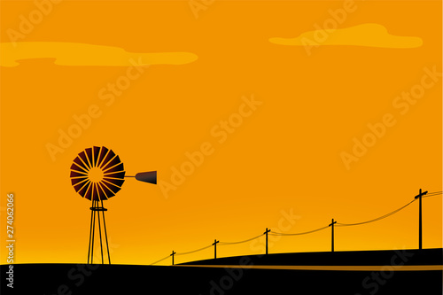 Rural scene. Windmill and road at till.