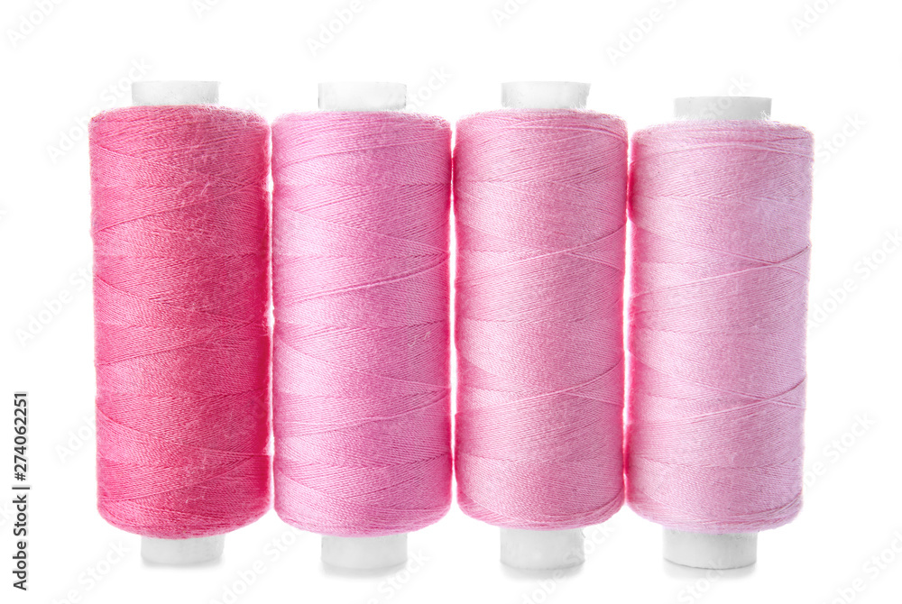 Colorful sewing threads on white background Colorful sewing threads on white background