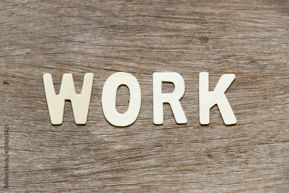 Alphabet letter in word work on wood background Alphabet letter in word work on wood background