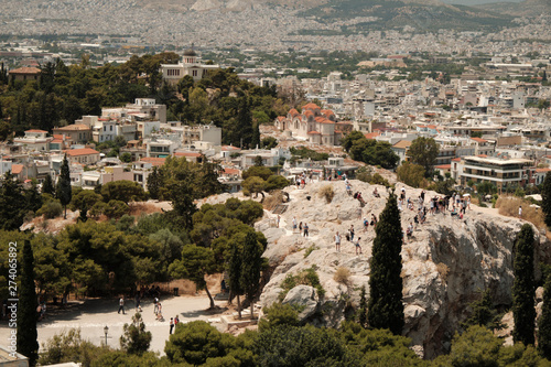 tourists walking in the ancient area near Acropolis in a sunny day in the capital of Greece JUNE 2019 - Athens.