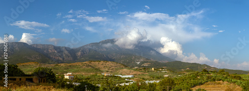 Dim River National Park mountain range in the clouds. Panoramic landscape of mountains with cloudscape. © Garmon