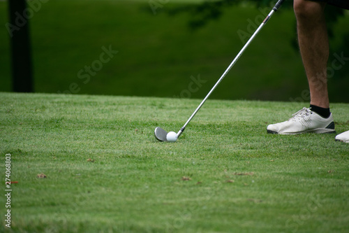 golf ball and club on the course