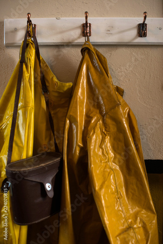 Old raincoats on a hook