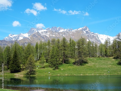 The Lake Lod, in the Alps near the village of Chamois, Valle d'Aosta, Italy - June 2019.