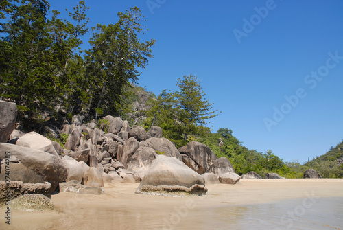Beach scene, granite rocks and hoop pines, Florence Bay, Magnetic Island, Queensland, Australia