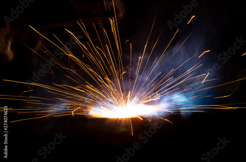 Foto Sparks from welding at a construction site as a background