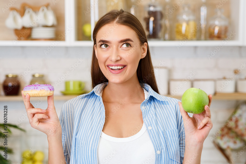 Diet. Beautiful Woman Choosing Between Fruits and Sweets Diet. Beautiful Woman Choosing Between Fruits and Sweets