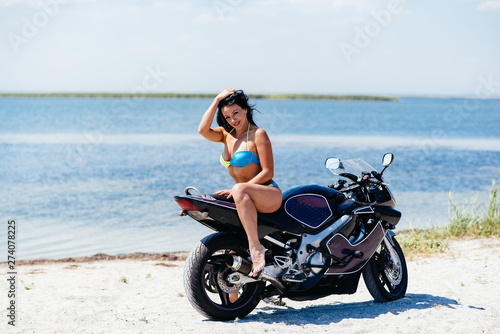 Girl motorcycle beach
