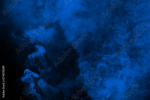 Abstract blue smoke on black background. Blue color clouds.