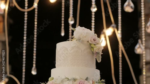 Detail of wedding cake cutting by newlyweds Wedding cake