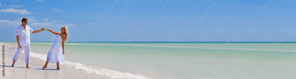 Happy Young Couple Dancing Holding Hands on Beach Panorama Happy Young Couple Dancing Holding Hands on Beach Panorama