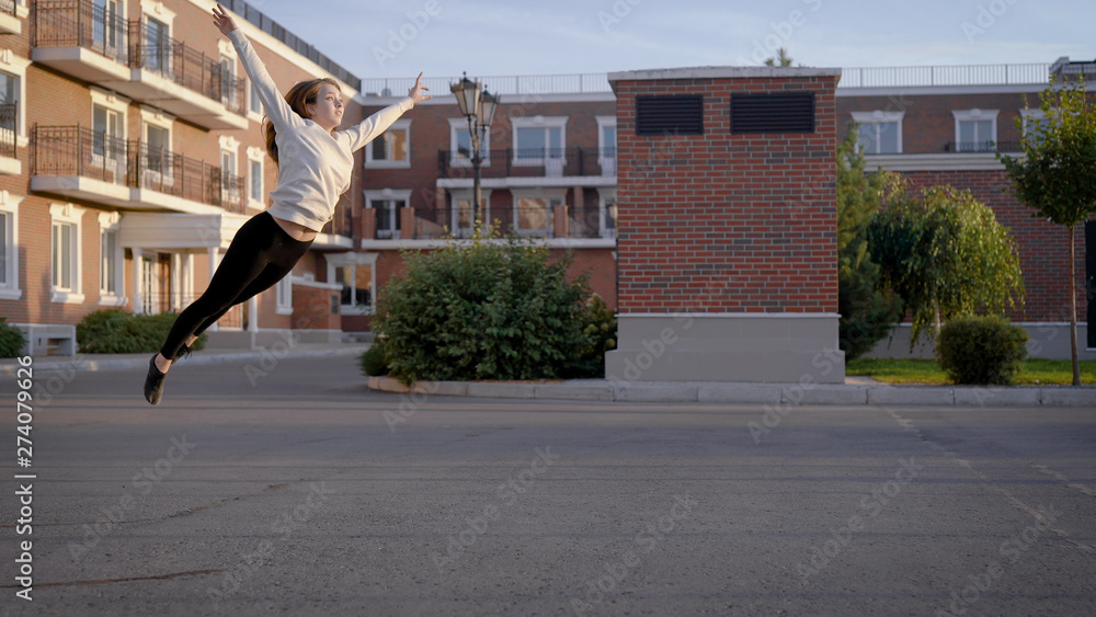 young girl is dancing on the street. Emotional dance in the style of Contemporary. young girl is dancing on the street. Emotional dance in the style of Contemporary.