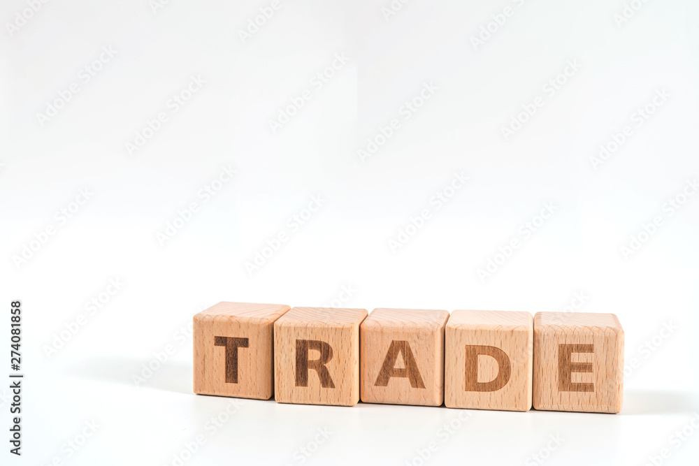 word TRADE on wood cube dices on white background. word TRADE on wood cube dices on white background.