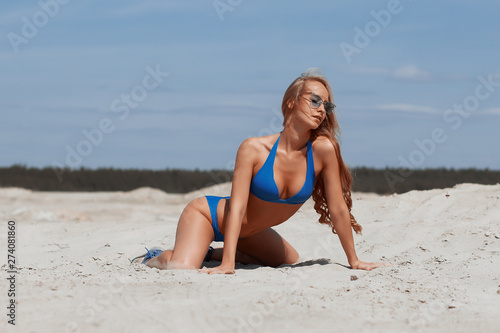Beautiful young girl in a sexy bikini on the beach Stock Photo | Adobe Stock