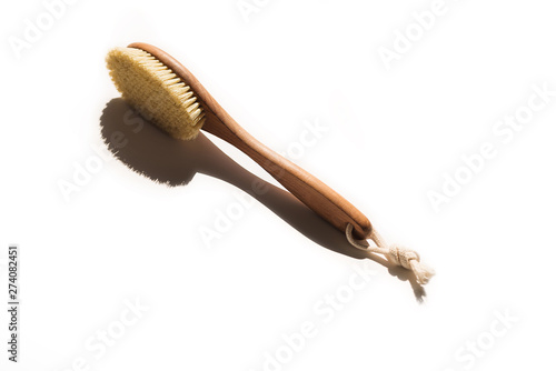 Spa organic brush for dry massage. Cactus brush. Anti-cellulite massage. Spa beauty concept.Spa organic brush for dry massage on white background with copy space. Cactus brush. Anti-cellulite massage. photo