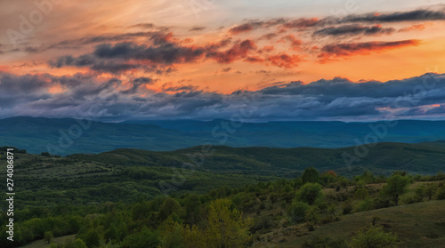 Colorful Spring Sunset over mountains and dramatic sky © b. Sergiu