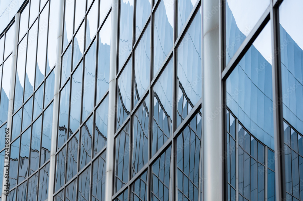 abstract background reflected in the glass windows of the building abstract background reflected in the glass windows of the building