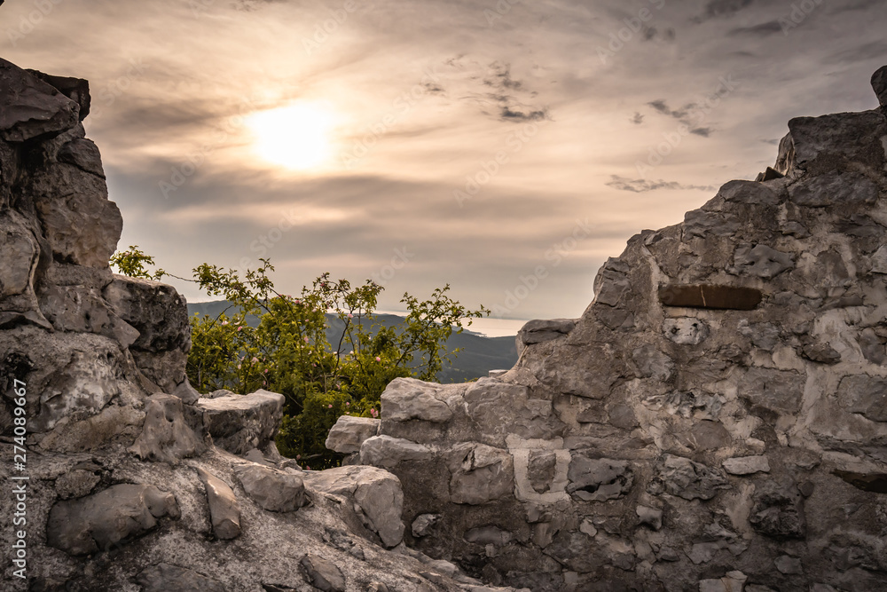 beautiful detail close up view on cliff and castle fortress rocks on crni kal hill with direct sunlight, slovenia