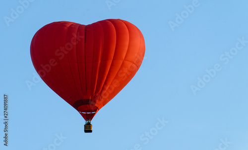 balloon heart on blue sky background symbol of love and romance © smspsy