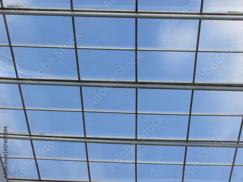 Glass roof under the blue sky of the day