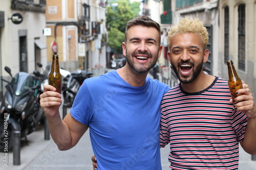 Two guys celebrating with beer 