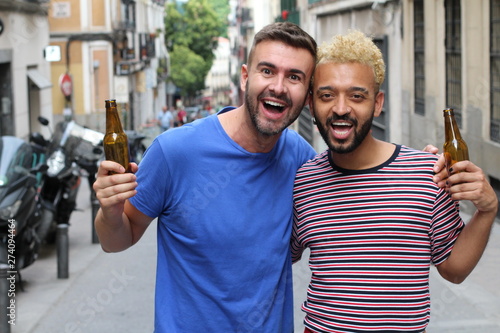 Canvas Print Two handsome dudes drinking outdoors