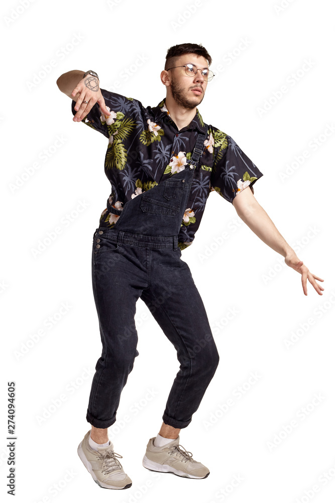 Full-length portrait of a funny guy dancing in studio isolated on white background. Full-length portrait of a funny guy dancing in studio isolated on white background.