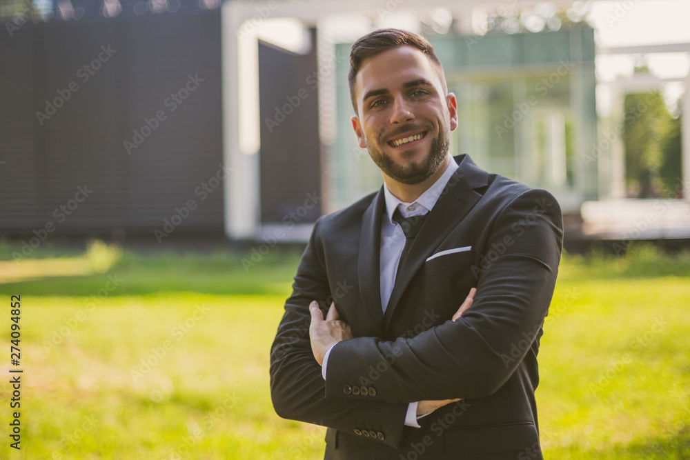 Portrait of elegant businessman enjoys standing outdoor.Toned photo. Portrait of elegant businessman enjoys standing outdoor.Toned photo.