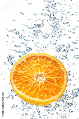 A background of splash forming after orange is dropped into it.