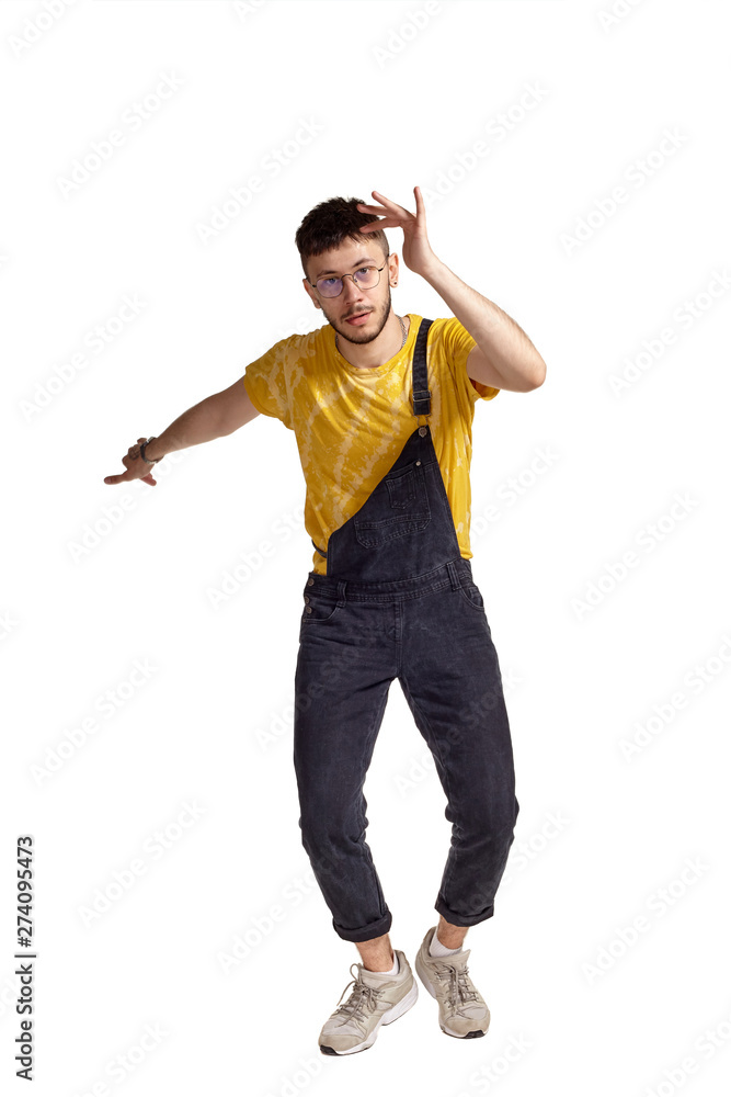 Full-length portrait of a funny guy dancing in studio isolated on white background. Full-length portrait of a funny guy dancing in studio isolated on white background.