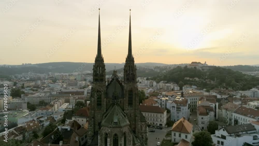 Brno Cityscape with Landmarks. Cathedral of St. Peter And St. Paul. Aerial View of Old Town with Medieval Gothic Church on Petrov Hill at Sunset. Europe, Czech Republic. 4K Pan Quadcopter Shot Brno Cityscape with Landmarks. Cathedral of St. Peter And St. Paul. Aerial View of Old Town with Medieval Gothic Church on Petrov Hill at Sunset. Europe, Czech Republic. 4K Pan Quadcopter Shot
