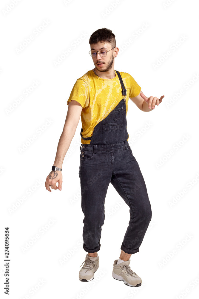 Full-length portrait of a funny guy dancing in studio isolated on white background. Full-length portrait of a funny guy dancing in studio isolated on white background.