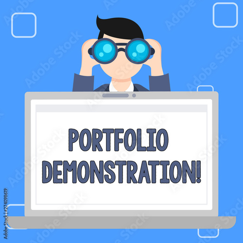 Writing note showing Portfolio Demonstration. Business concept for range of investments held by demonstrating or organization Man Holding and Looking into Binocular Behind Laptop Screen photo