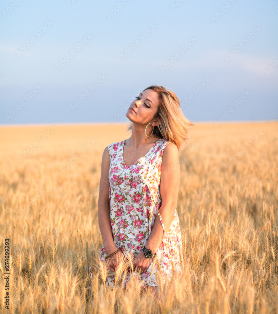 young seductive rural blond hair woman in dress on the yellow wheat field on the sunset young seductive rural blond hair woman in dress on the yellow wheat field on the sunset