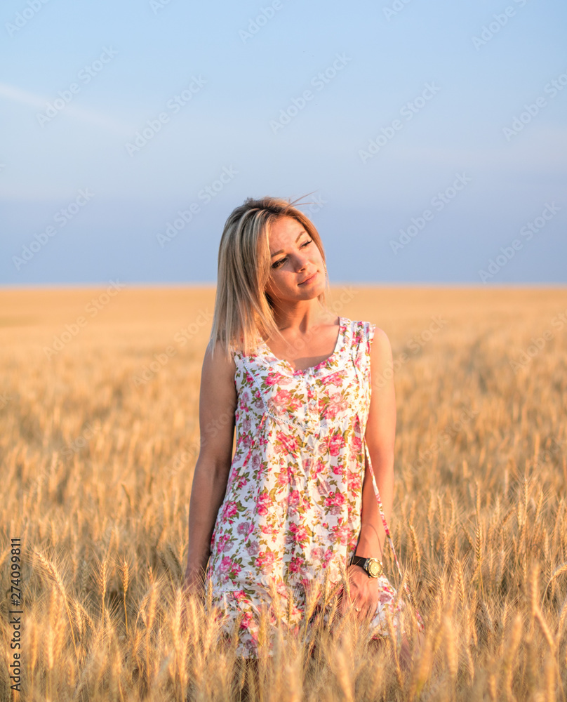 young seductive rural blond hair woman in dress on the yellow wheat field on the sunset young seductive rural blond hair woman in dress on the yellow wheat field on the sunset
