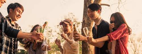 Canvas Print Hands of man in group of friends opening champange for celebrate, cropped dimens
